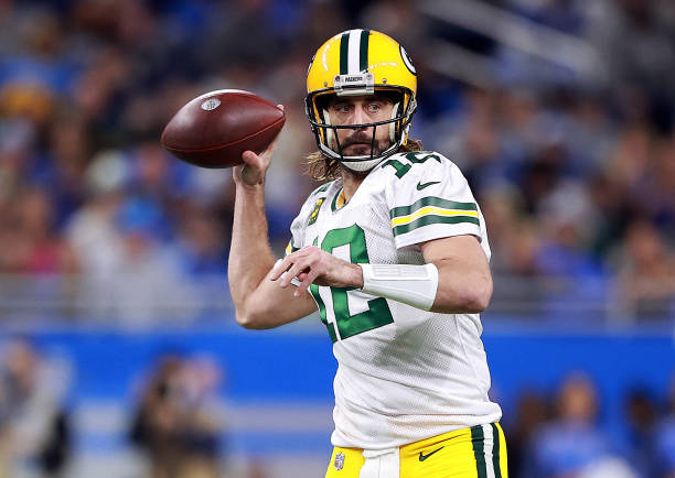 Aaron Rodgers of the Green Bay Packers looks to pass during the first quarter against the Detroit Lions at Ford Field on January 09, 2022 in Detroit,...
