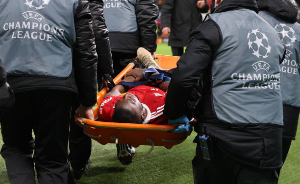 Aaron Wan-Bissaka of Manchester United is stretchered off after colliding with a advertising board during the UEFA Champions League group F match...