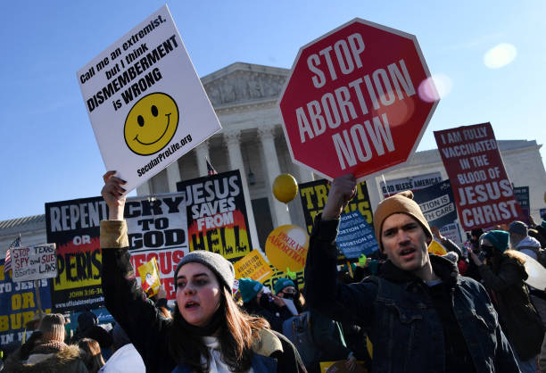 Abortion rights advocates and anti-abortion protesters demonstrate in front of the US Supreme Court in Washington, DC, on December 1, 2021. - The...
