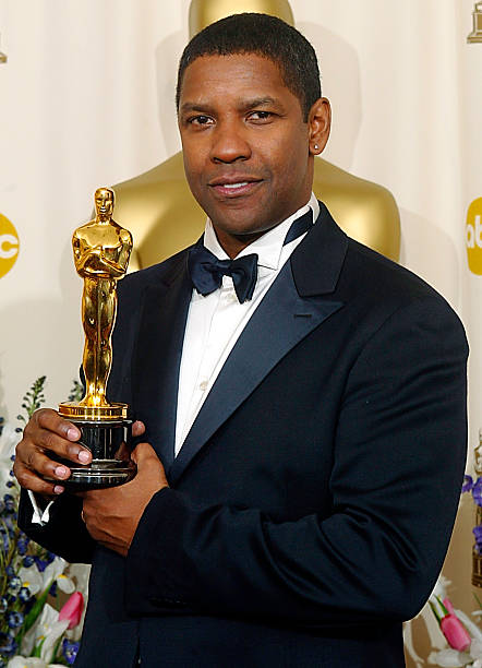 US actor Denzel Washington holds his Oscar after w Pictures | Getty Images