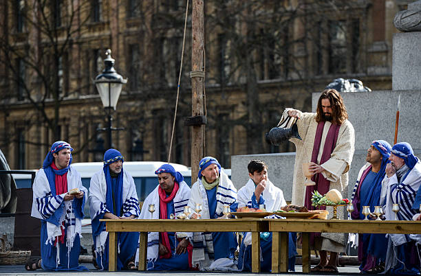 Actor James Burke-Dunsmore shares wine with his disciples during the last supper whilst playing Jesus during The Wintershall's 'The Passion of Jesus'...