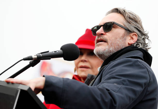 Actor Joaquin Phoenix onstage with actress and activist Jane Fond during the last Fire Drill Fridays climate change protest and rally on Capitol Hill...