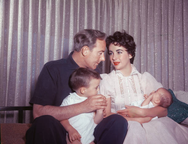 Actors Elizabeth Taylor and Michael Wilding with their sons Michael Jr and newborn Christopher, Los Angeles, California, 1955.
