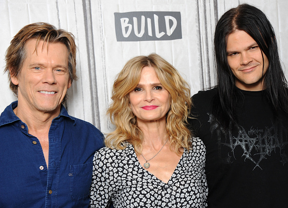 Travis Bacon with his parents