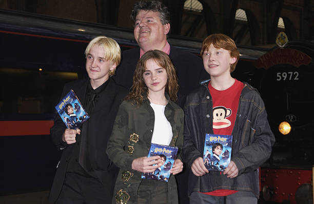 Actors, Robbie Coltrane, Rupert Grint, Emma Watson and Tom Felton at the 'Harry Potter and The Philosopher's Stone' DVD launch party held on platform...