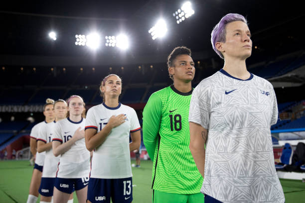 Adrianna Franch and Megan Rapinoe of Team United States stand for the national anthem prior to the Women's Quarter Final match between Netherlands...