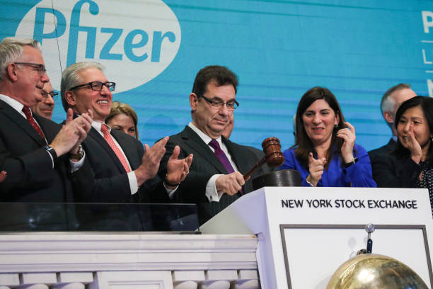 Albert Bourla, chief executive officer of Pfizer pharmaceutical company, bangs a gavel after ringing the closing bell at the New York Stock Exchange...