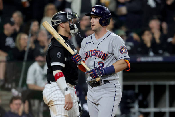 Alex Bregman of the Houston Astros walks back to the dugout after striking out in the seventh inning during game 3 of the American League Division...
