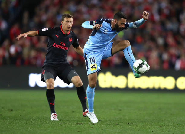 alex brosque of sydney fc controls the ball over krystian bielik of picture