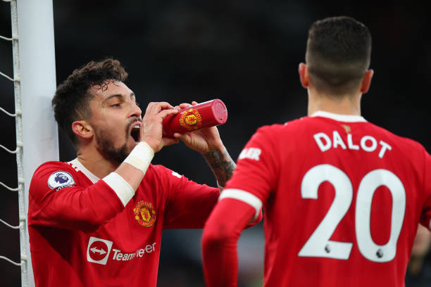 Alex Telles and Diogo Dalot of Manchester United during the Premier League match between Manchester United and Crystal Palace at Old Trafford on...