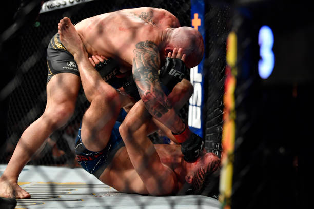 Alexander Volkanovski of Australia punches Brian Ortega in their UFC featherweight championship fight during the UFC 266 event on September 25, 2021...