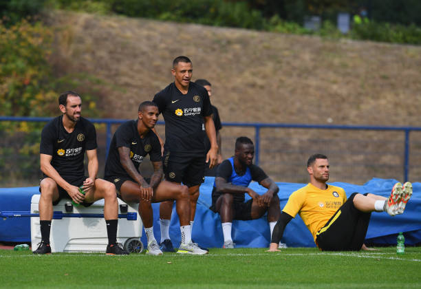 Alexis Sanchez Diego Roberto Godín Leal and Ashley Young of FC Internazionale look on during a FC Internazionale training session on August 11 2020...