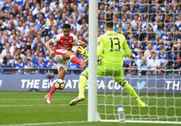 Alexis Sanchez of Arsenal scores his teams first goal during The Emirates FA Cup Final between Arsenal and Chelsea at Wembley Stadium on May 27, 2017...