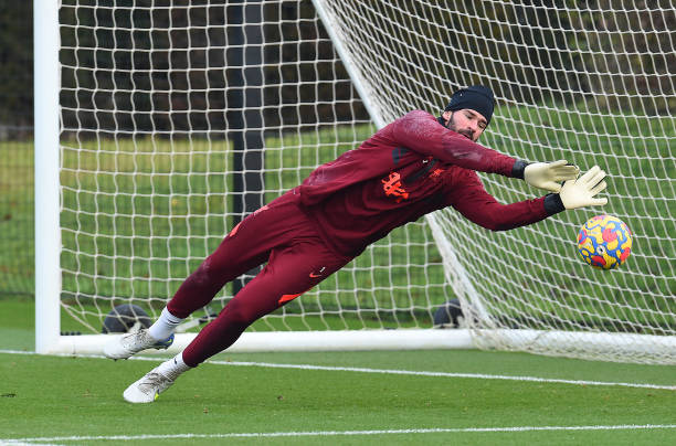 Alisson Becker of Liverpool during a training session at AXA Training Centre on December 24, 2021 in Kirkby, England.