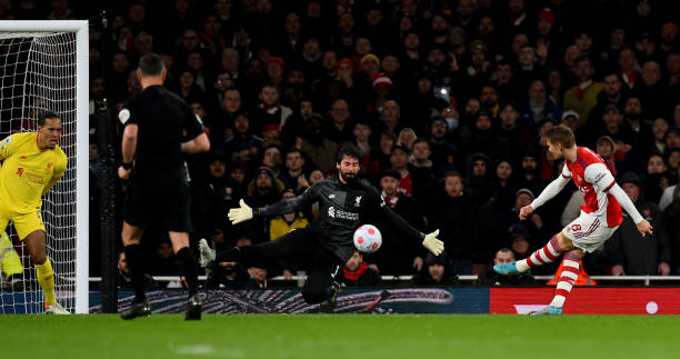 Alisson Becker of Liverpool makes great save fron Martin Odegaard of Arsenal during the Premier League match between Arsenal and Liverpool at...
