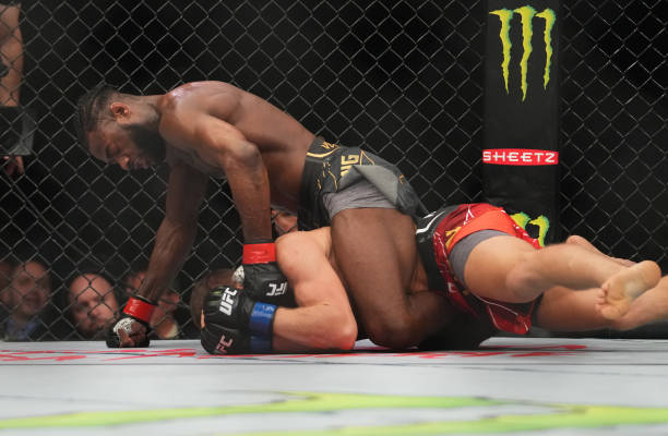Aljamain Sterling punches Petr Yan of Russia in their UFC bantamweight championship fight during the UFC 273 event at VyStar Veterans Memorial Arena...