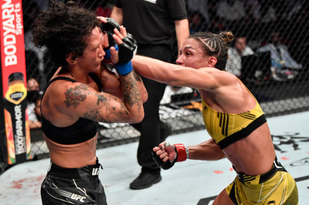 Amanda Ribas of Brazil punches Virna Jandiroba of Brazil in a strawweight fight during the UFC 267 event at Etihad Arena on October 30, 2021 in Yas...