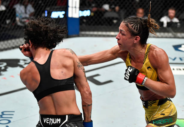Amanda Ribas of Brazil punches Virna Jandiroba of Brazil in a strawweight fight during the UFC 267 event at Etihad Arena on October 30, 2021 in Yas...