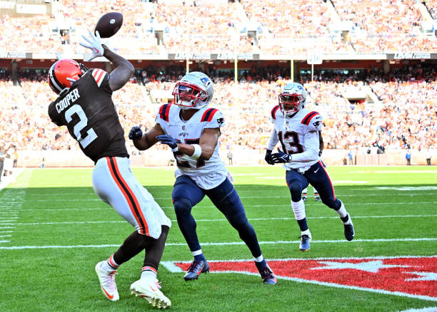 Amari Cooper of the Cleveland Browns catches a touchdown over Myles Bryant of the New England Patriots during the fourth quarter at FirstEnergy...