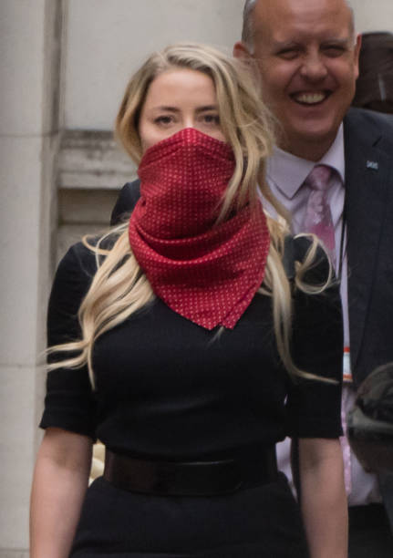 Amber Heard leaves the Royal Courts of Justice Strand on July 07 2020 in London England Johnny Depp is taking News Group Newspapers publishers of The...