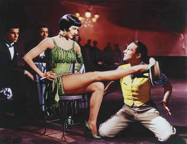 American actors and dancers Cyd Charisse and Gene Kelly on the set of Singin` in the Rain, directed by Stanley Donen and Gene Kelly.