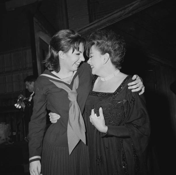 American actress and singer Liza Minnelli with her mother, American actress and singer Judy Garland , backstage after she opened in `Flora the Red...