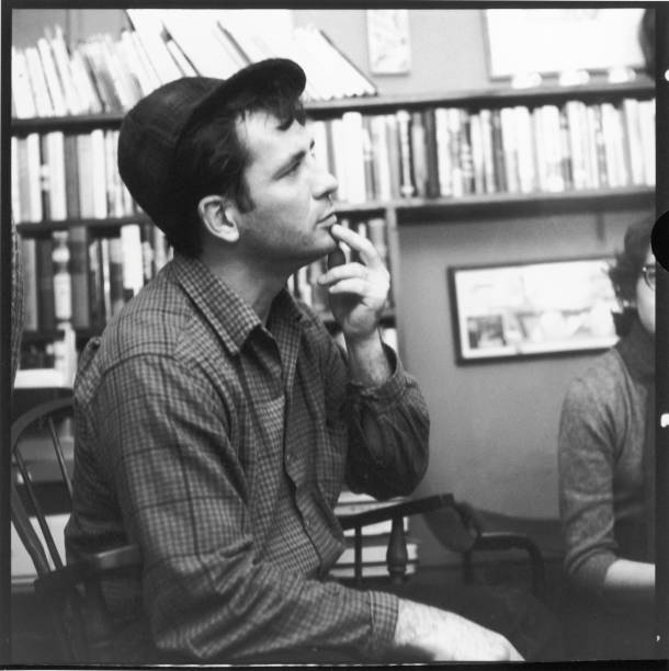 American author and poet Jack Kerouac contemplates a poem at the apartment of photographer McDarrah and his soon-to-be wife, Gloria , New York, New...