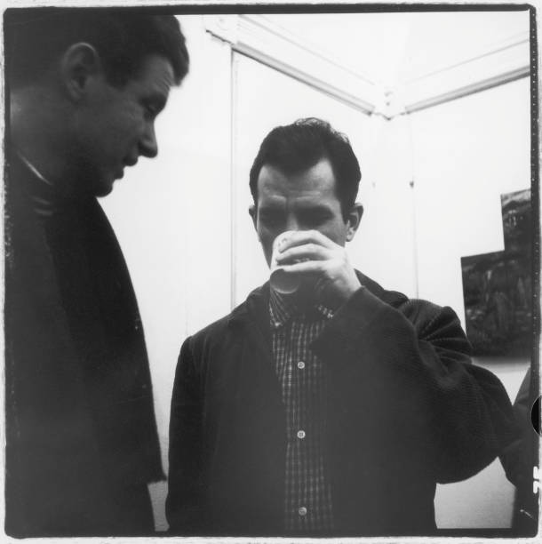 American musician, composer, and conductor David Amram and author Jack Kerouac talk together at the Hansa Gallery , New York, New York, March 16,...