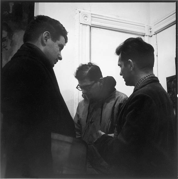 American musician, composer, and conductor David Amram and authors Allen Ginsberg and Jack Kerouac talk together at the Hansa Gallery , New York, New...