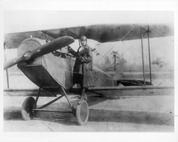 American pilot Bessie Coleman in her bi-plane, circa 1920.