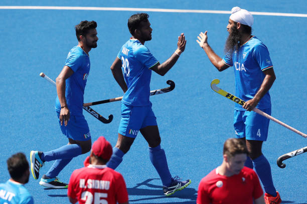 Amit Rohidas of Team India celebrates with team mate Singh Jarmanpreet after scoring their sides second goal during Men's Hockey - Pool B match...