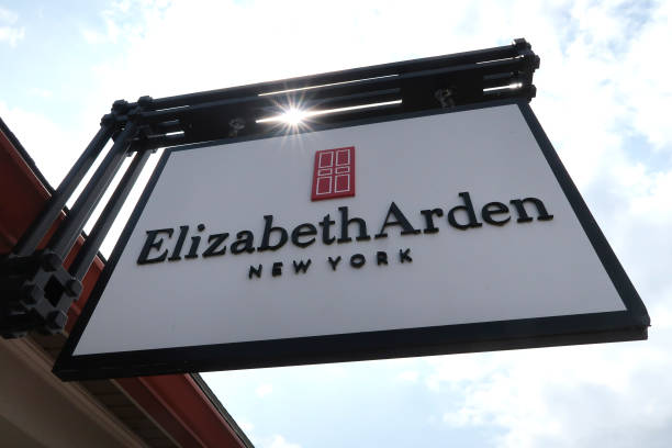 an elizabeth arden sign hangs in front of their store at the woodbury picture
