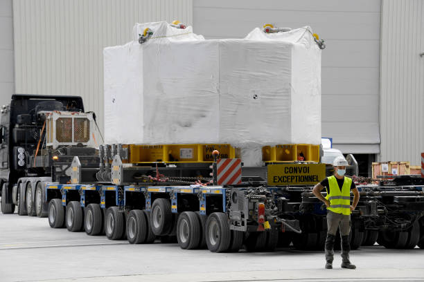 An engineer stands next to the world's most powerful magnet as it is delivered at the international nuclear fusion project Iter in...