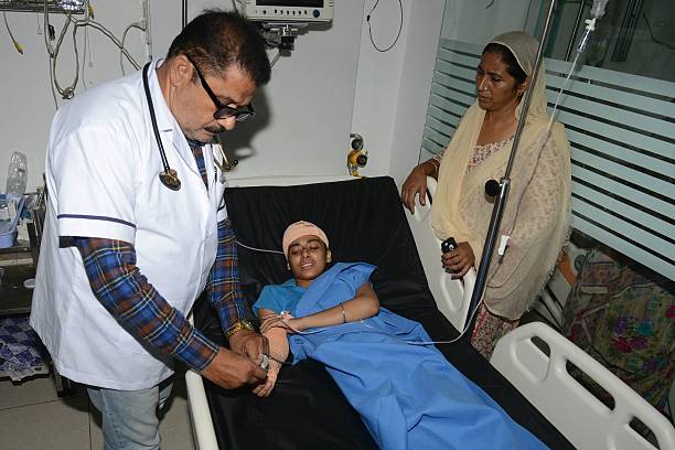 An Indian doctor inspects an injured school girl Gurleen as she undergoes treatment at a hospital in Amritsar on September 20 2016 Eight... Punjabi Songs Online Listen and Download Videos, Images