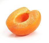 An ripe orange apricot cut in half