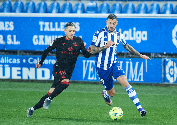 Andoni Gorosabel of Real Sociedad duels for the ball with Jose Luis Mato 'Joselu' of Deportivo Alaves during the La Liga Santander match between...