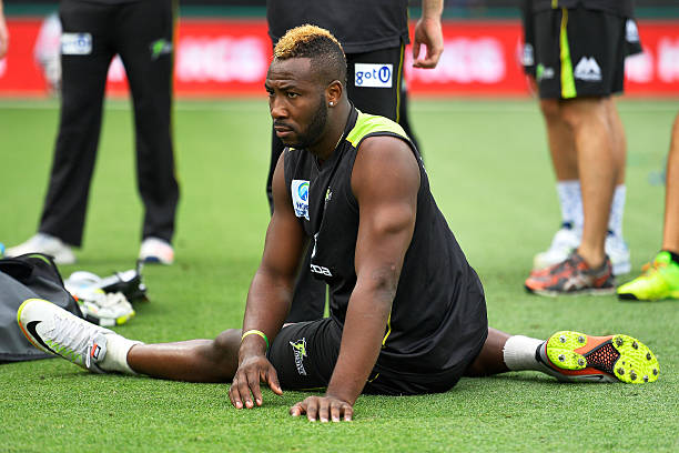 Andre Russell of the Thunder stretches prior to the Big Bash League match between the Sydney Thunder and Melbourne Stars at Spotless Stadium on...