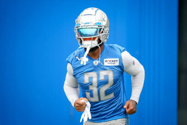 Andre Swift of the Detroit Lions enters the practice field during the Detroit Lions Training Camp on July 27, 2022 in Allen Park, Michigan.