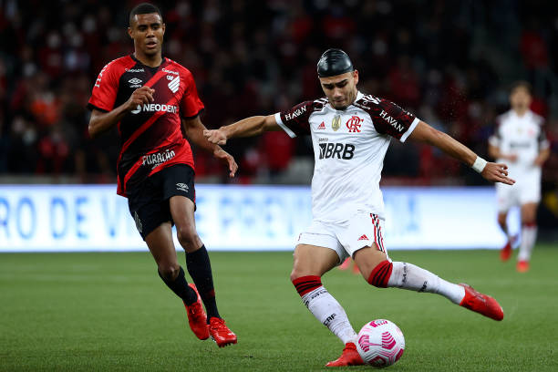 Andreas Pereira of Flamengo struggles for the ball with Erick of Athletico Paranaense during a match between Flamengo and Athletico Paranaense as...