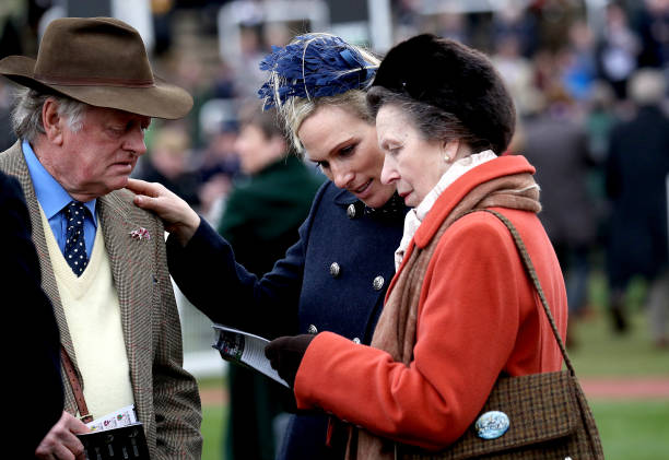 Andrew Parker Bowles with Zara Tindall centre and The Princess Royal on day one of the Cheltenham Festival at Cheltenham Racecourse Cheltenham