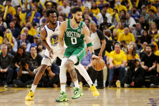 Andrew Wiggins of the Golden State Warriors guards Jayson Tatum of the Boston Celtics during the third quarterin Game Two of the 2022 NBA Finals at...