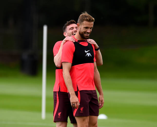 Andy Robertson and Jordan Henderson captain of Liverpool during a training session at AXA Training Centre on August 04, 2022 in Kirkby, England.