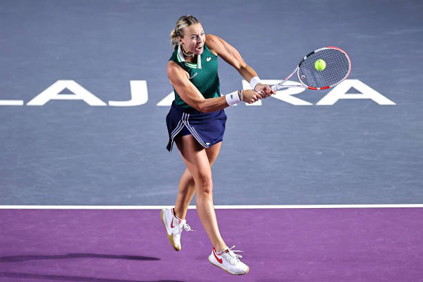 Anett Kontaveit of Estonia plays a backhand in Women's Singles final match against Garbiñe Muguruza of Spain during Day 8 of 2021 Akron WTA Finals...