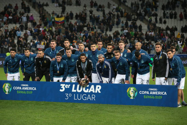 Angel Di Maria of Argentina poses with teammates after receiving the third place medal the Copa America Brazil 2019 Third Place match between...