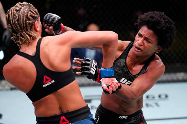 Angela Hill punches Ashley Yoder in a strawweight fight during the UFC Fight Night event at UFC APEX on March 13, 2021 in Las Vegas, Nevada.