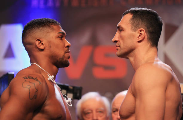 anthony-joshua-and-wladimir-klitschko-face-each-other-during-the-to-picture-id674401798