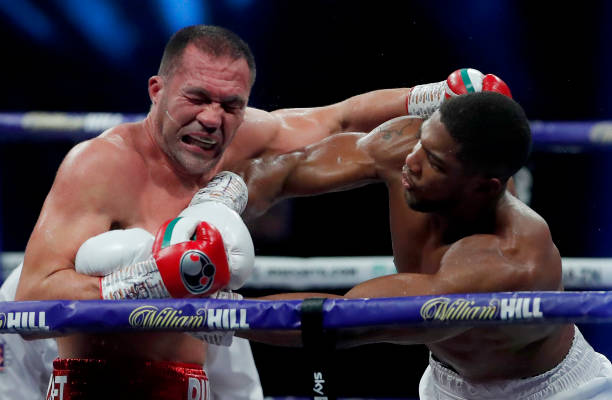 Anthony Joshua punches Kubrat Pulev during the IBF, WBA, WBO and IBO World Heayweight Title fight between Anthony Joshua and Kubrat Pulev at The SSE...