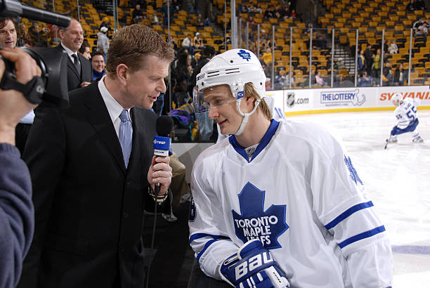 anton-stralman-of-the-toronto-maple-leafs-talks-with-a-newscaster-picture-id79098013