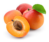 Apricot isolate. Apricots with slice on white. Fresh apricots. With clipping path. Full depth of field.