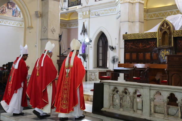 Archbishop of Colombo, Cardinal Malcolm Ranjith participates in a live broadcast of Good Friday service mass at the almost deserted All Saints church...